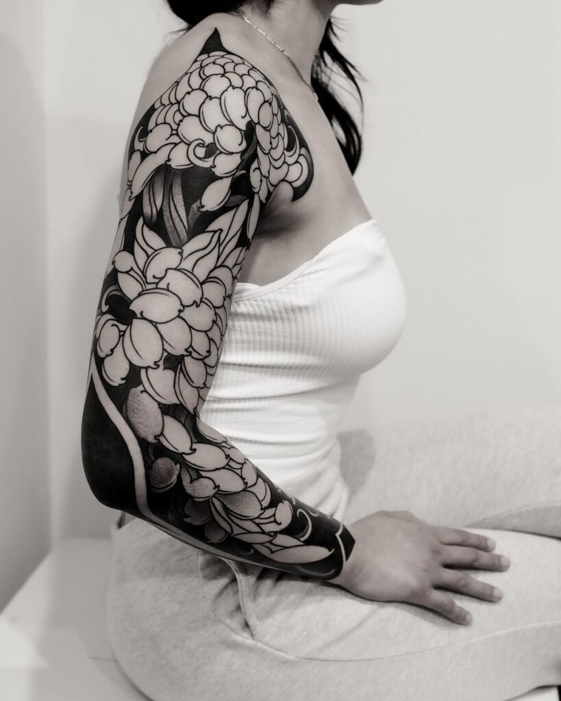 Monochrome Peony Sleeve with Blackout Background Tattoo Design