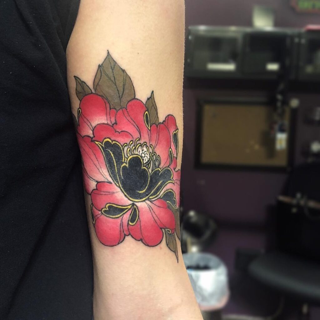 Red and Black Peony Forearm Tattoo with Gold Accents Tattoo Design