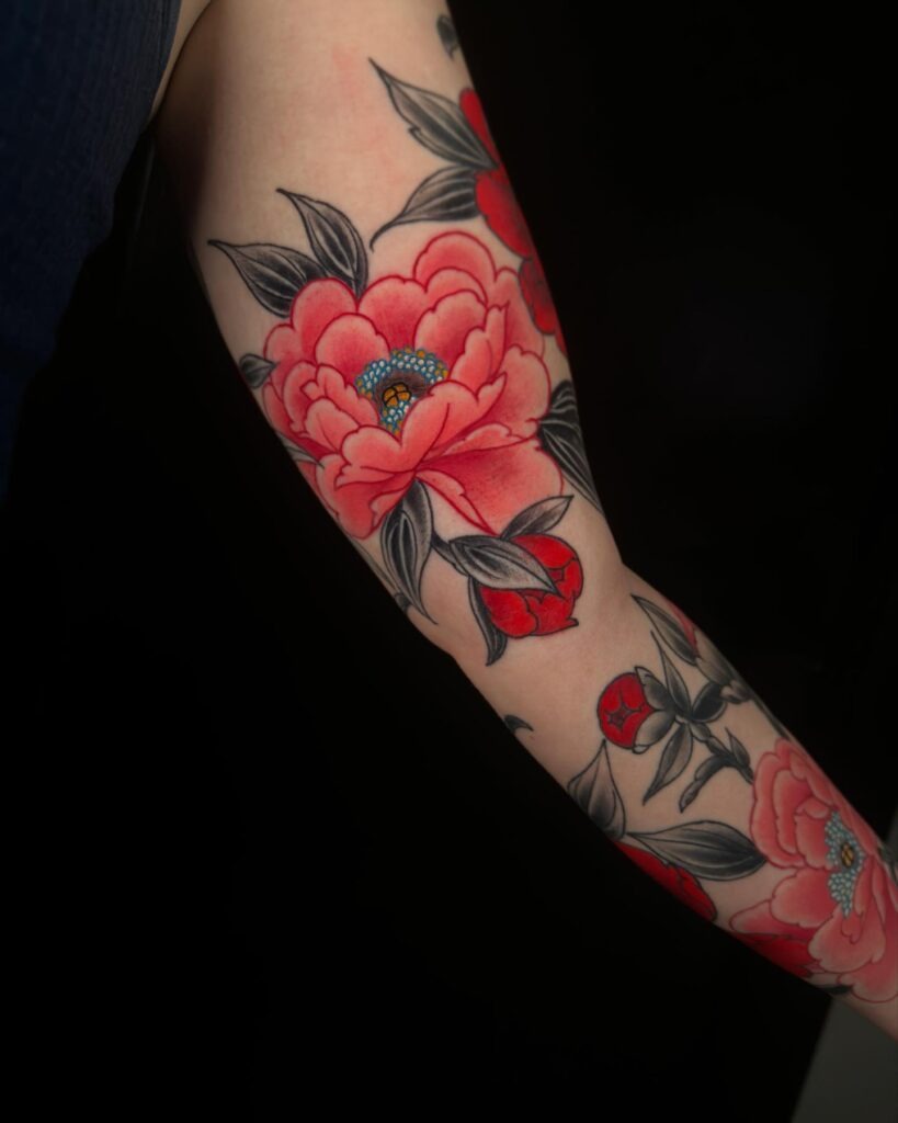 Vibrant Peony Sleeve with Blue Accents Tattoo Design