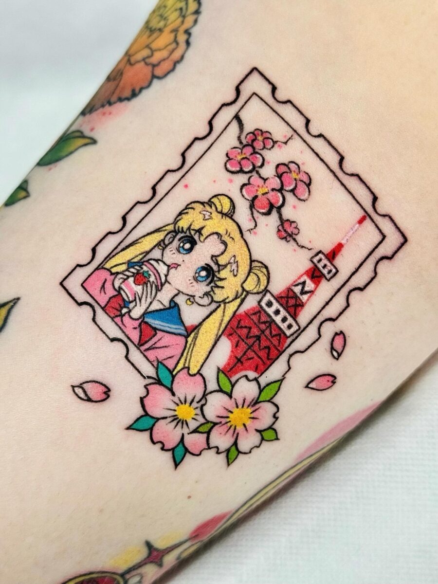 Charming Sailor Moon Tattoo with Sakura Elements Tattoo Design