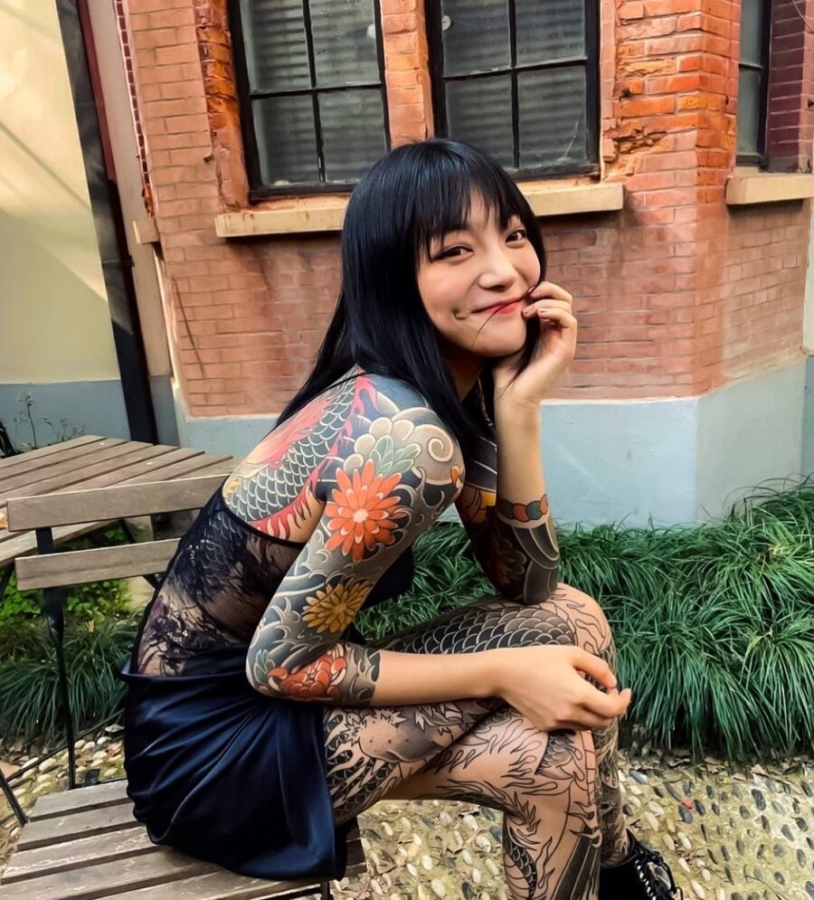 Colorful Japanese Tattoos on a Smiling Model Tattoo Design
