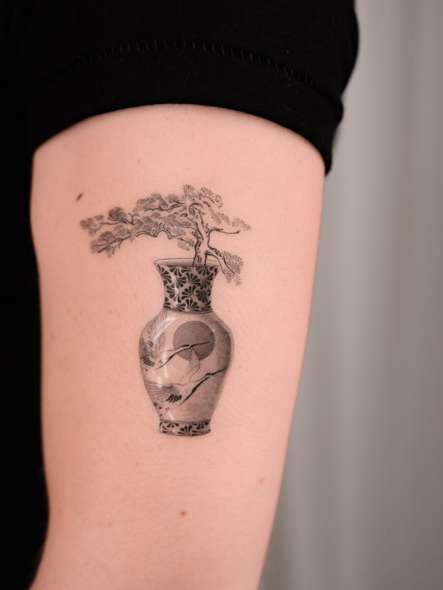 Elegant bonsai tattoo in a detailed vase Tattoo Design