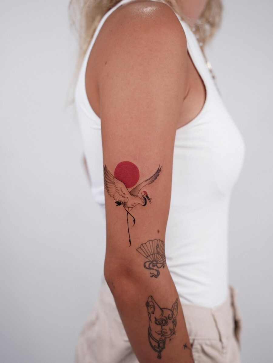 Elegant crane tattoo with rising sun symbolism Tattoo Design
