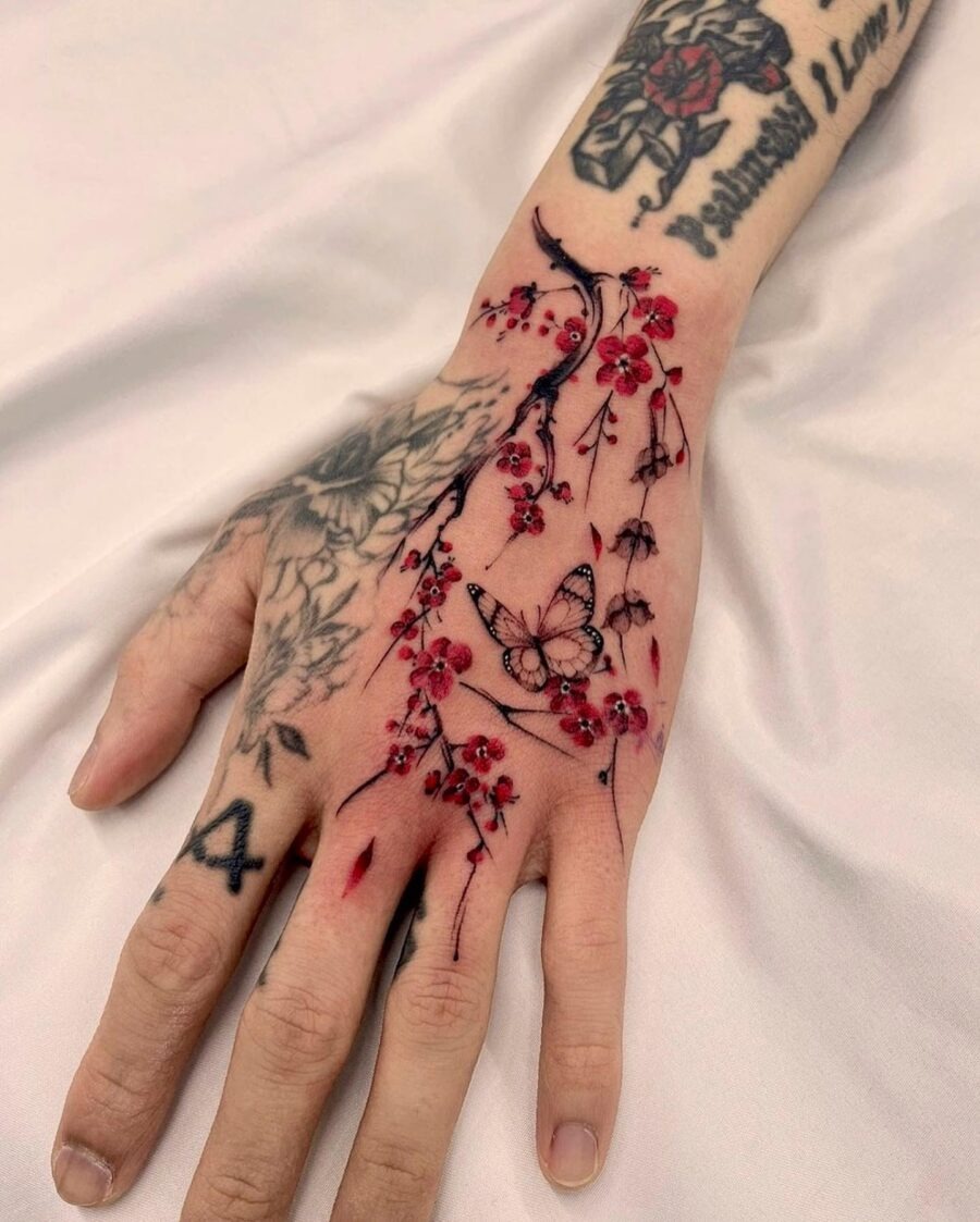 Elegant floral hand tattoo featuring a butterfly Tattoo Design