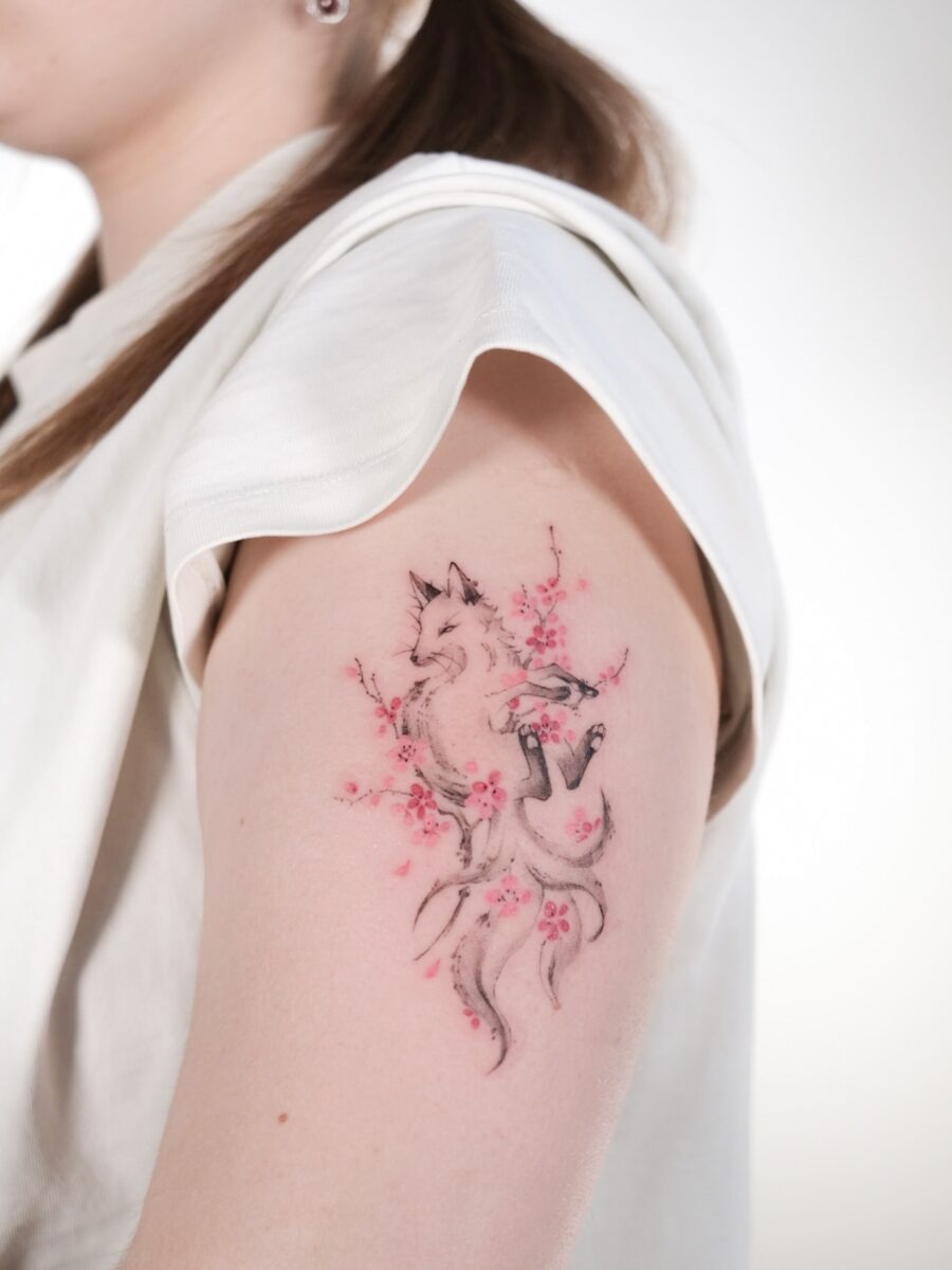 Elegant fox tattoo with cherry blossoms Tattoo Design