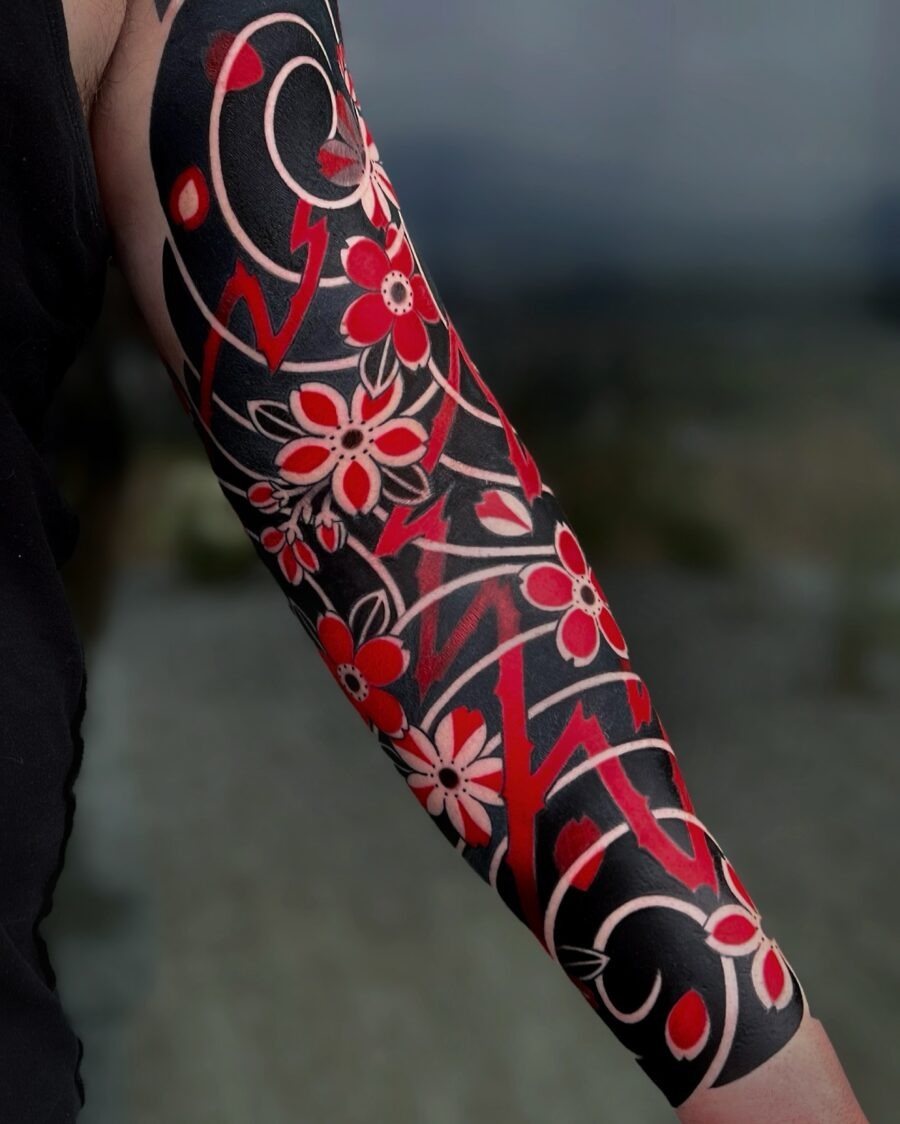 Intricate floral Japanese tattoo on the arm Tattoo Design
