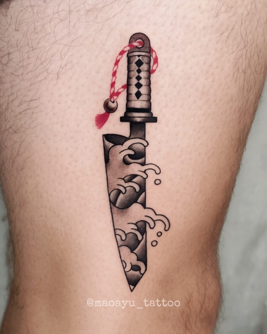 Intricate Japanese Knife Tattoo with Waves Tattoo Design