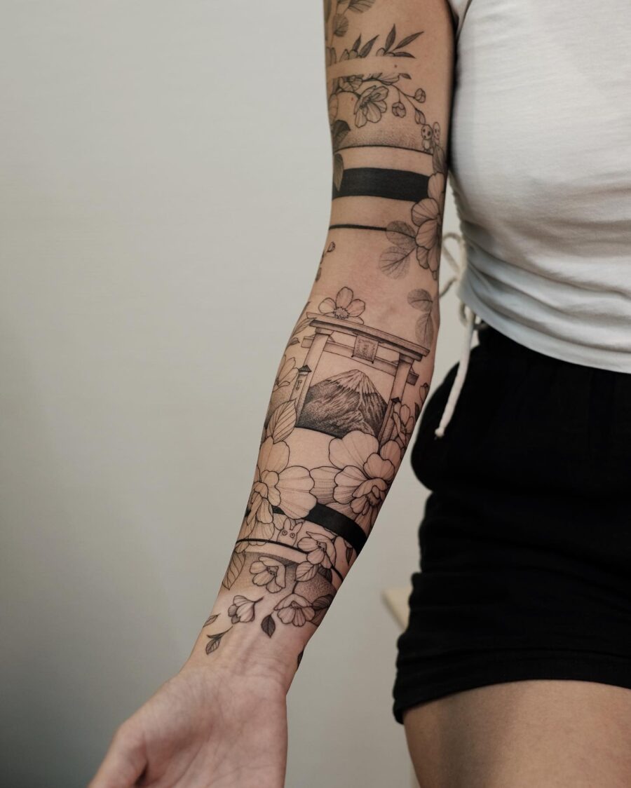 Intricate Japanese-style floral arm tattoo Tattoo Design