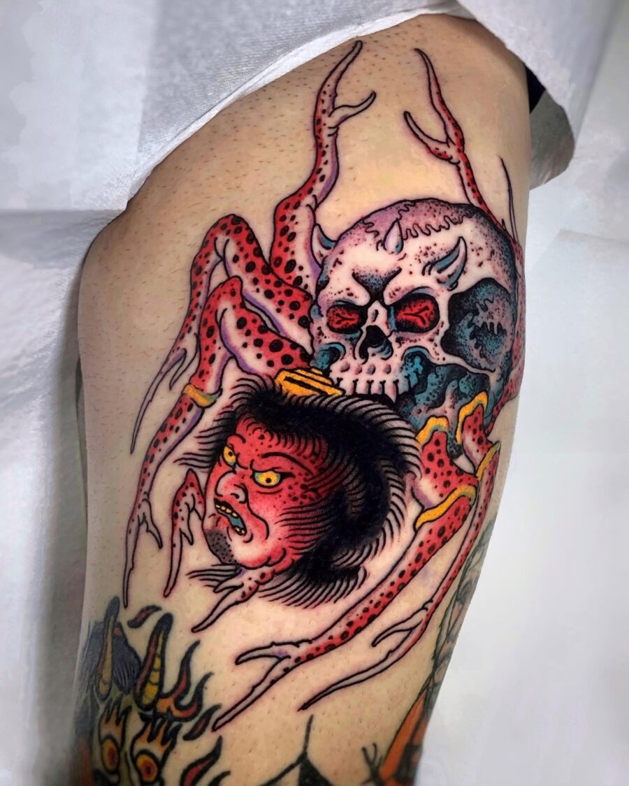 Striking Japanese tattoo featuring skull and spider. Tattoo Design