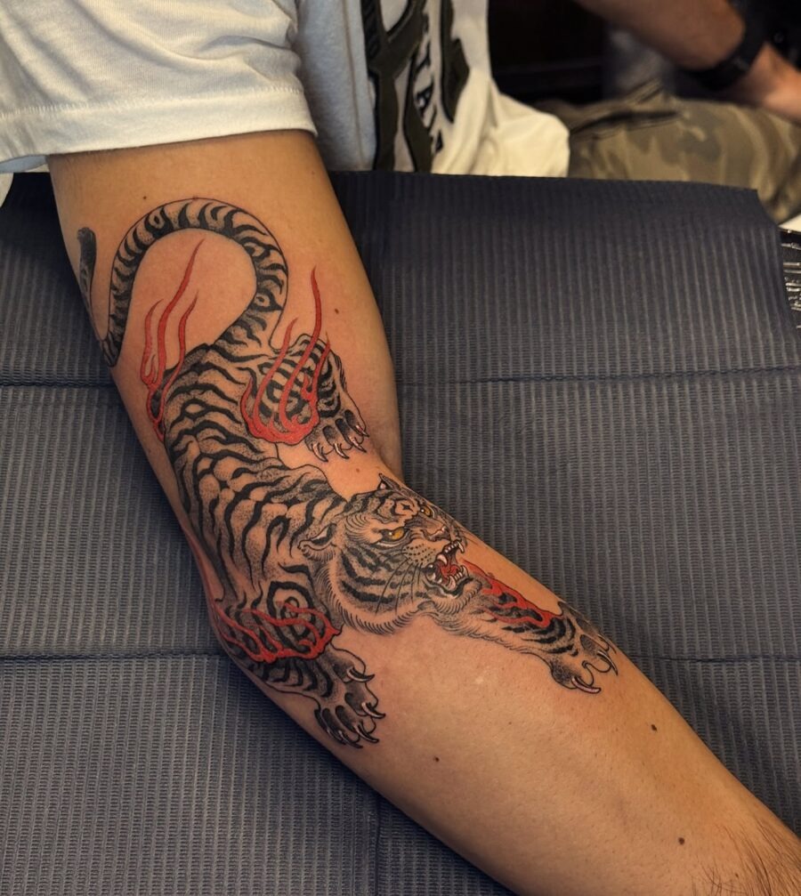 Striking tiger tattoo with bold red flames Tattoo Design