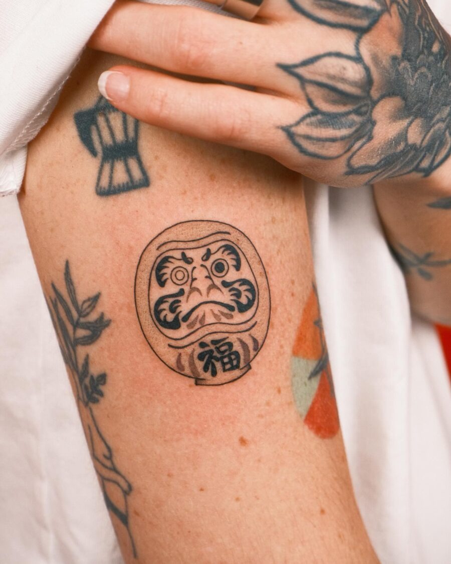 Symbolic Daruma Tattoo Artwork on Skin Tattoo Design