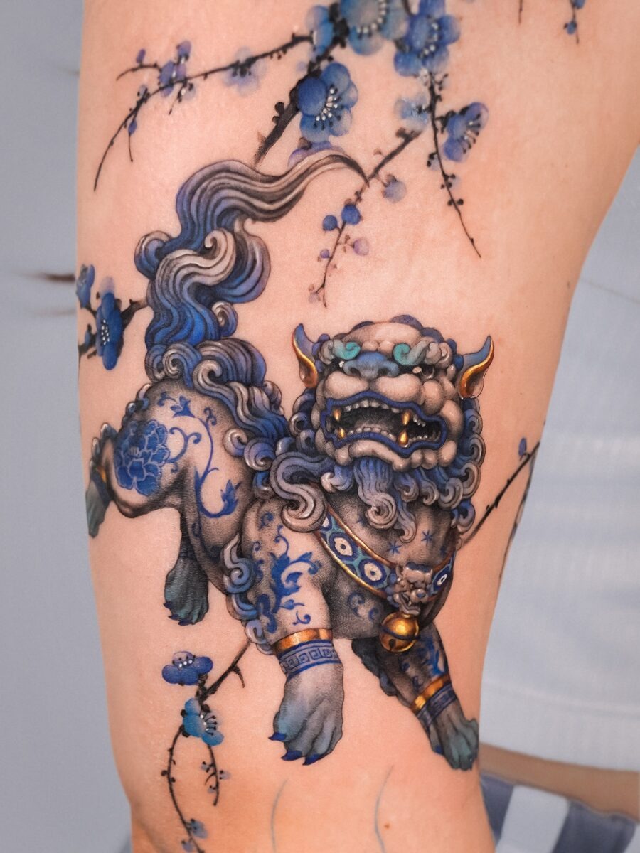 Vibrant lion dog tattoo with blooming flowers Tattoo Design