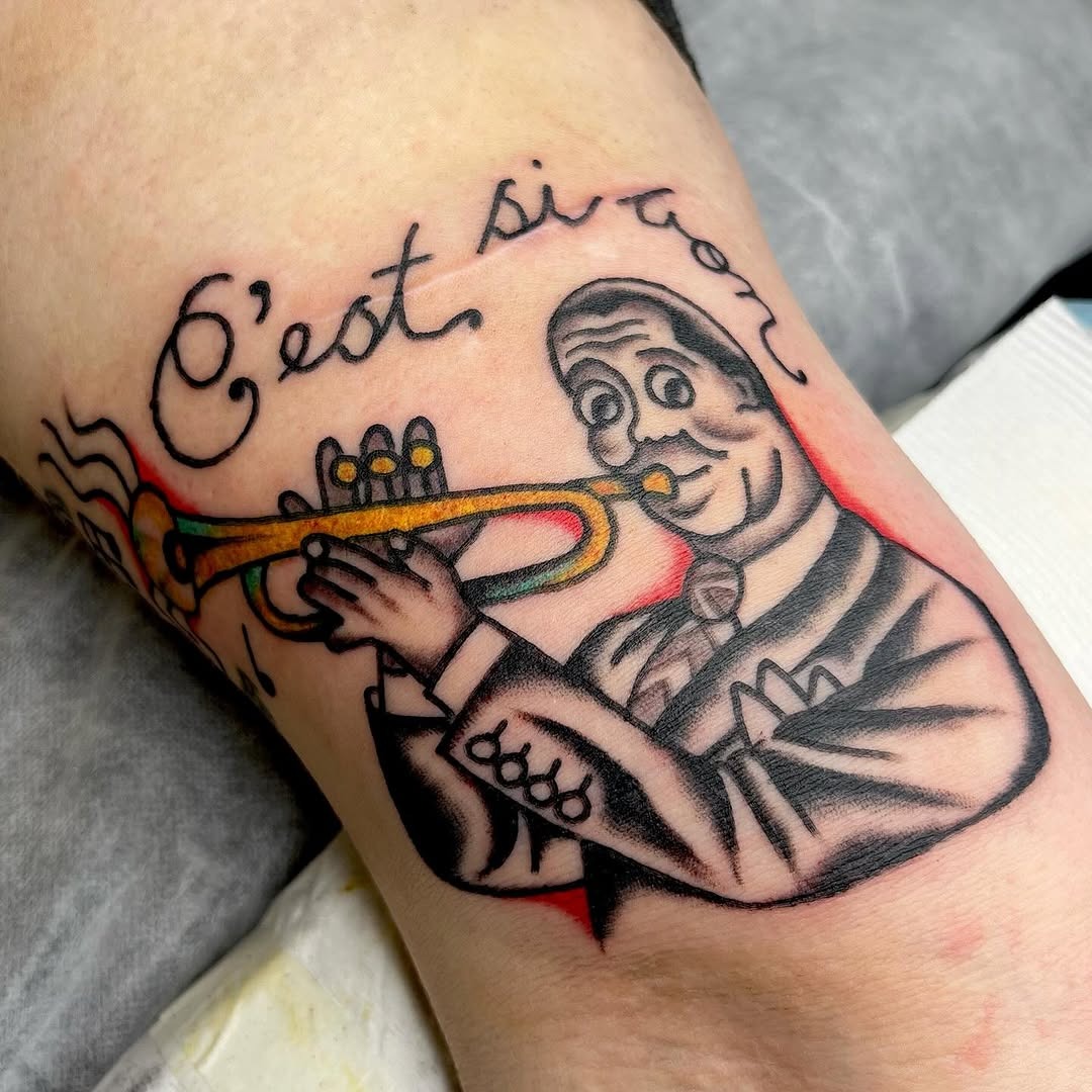 Classic jazz trumpet player tattoo with vibrant colors Tattoo Design