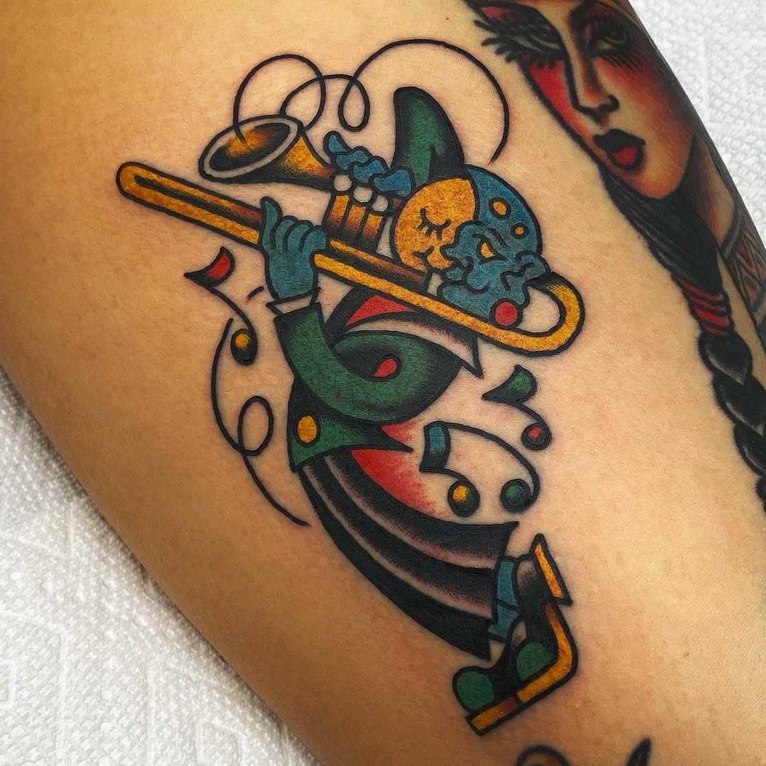 Colorful clown playing a trumpet tattoo Tattoo Design