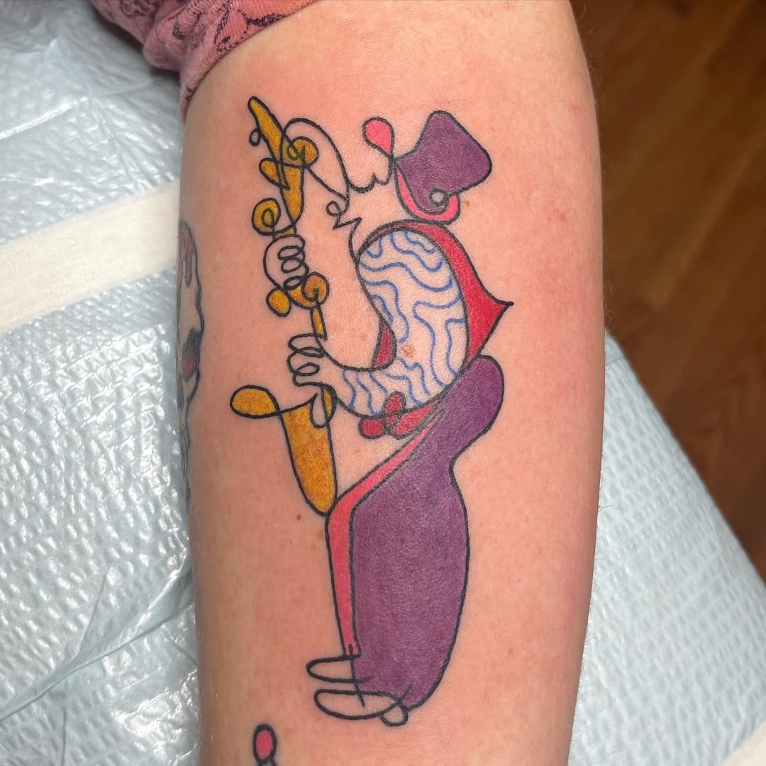 Colorful saxophonist tattoo exuding musical vibes Tattoo Design