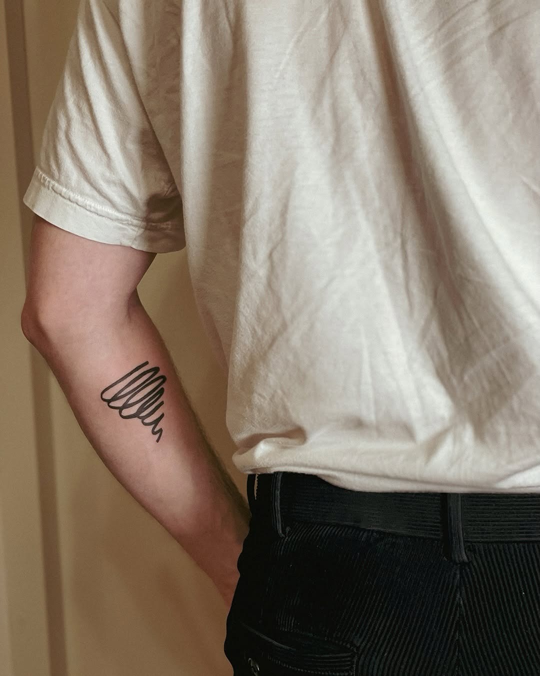 Elegant minimalist jazz-inspired tattoo on arm Tattoo Design