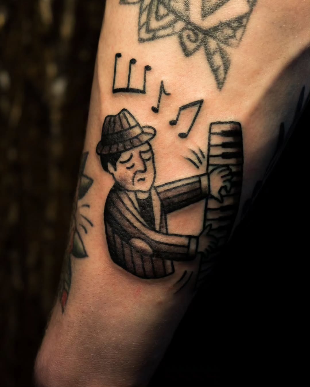 Stylish jazz musician playing the piano tattoo Tattoo Design