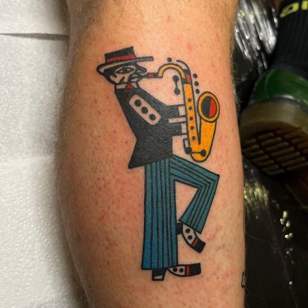 Stylish jazz saxophonist tattoo in vibrant colors Tattoo Design
