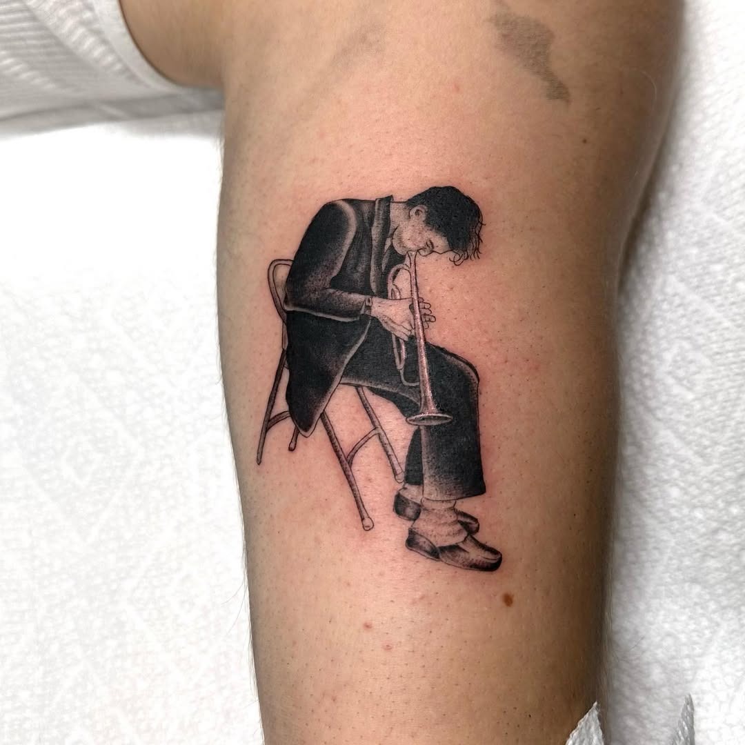 Stylish trumpet player tattoo inspired by jazz Tattoo Design