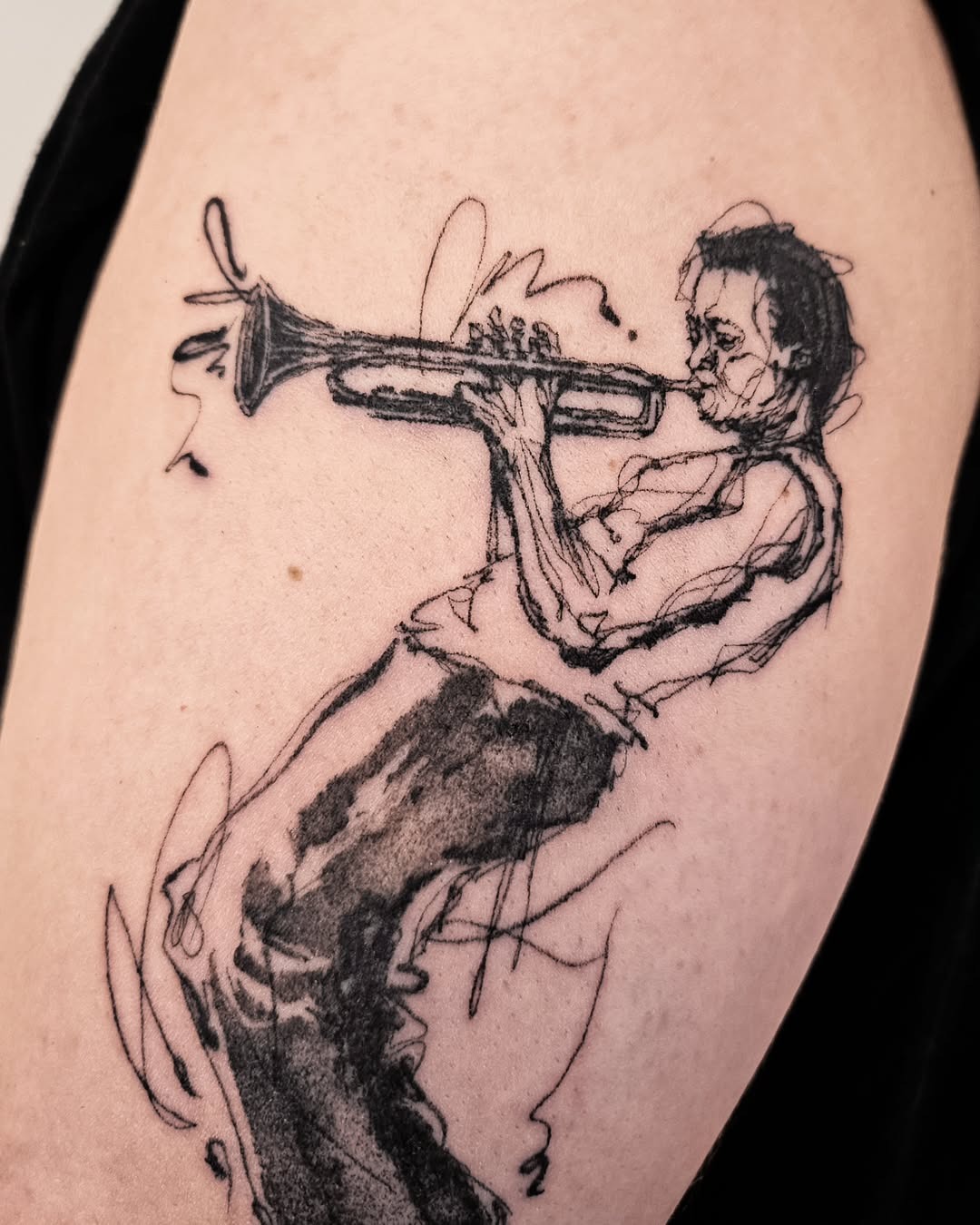 Stylized jazz musician playing trumpet tattoo Tattoo Design