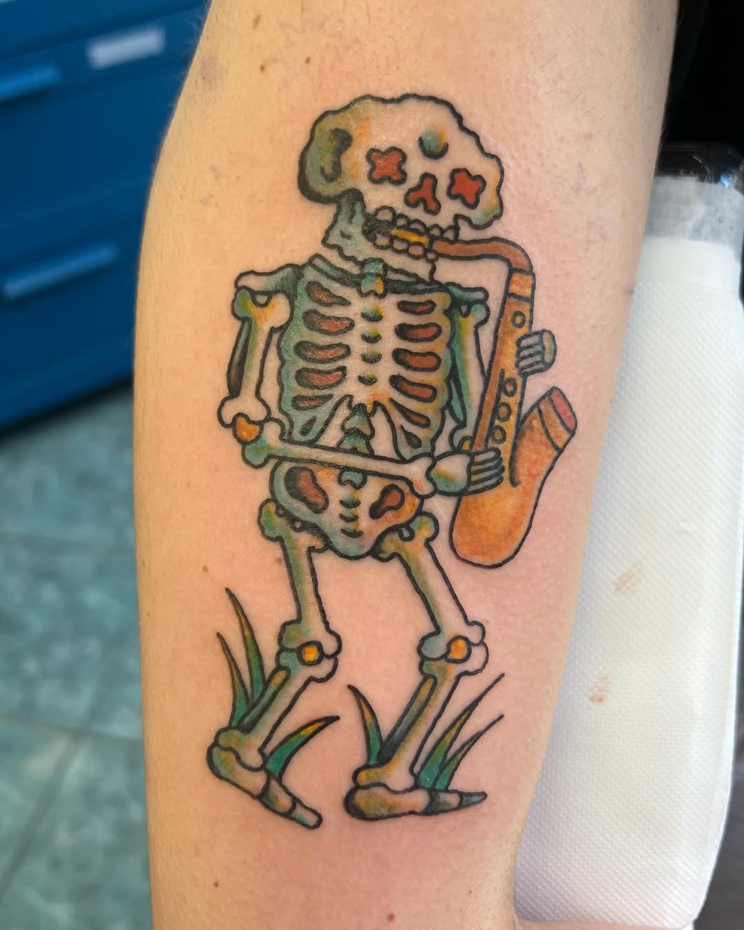 Whimsical skeleton playing saxophone tattoo Tattoo Design