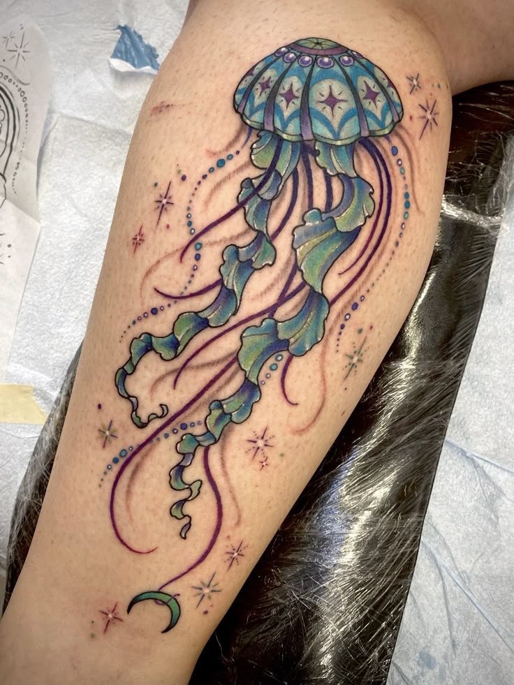 Art Nouveau inspired jellyfish tattoo featuring whiplash curves and decorative ornamental archways