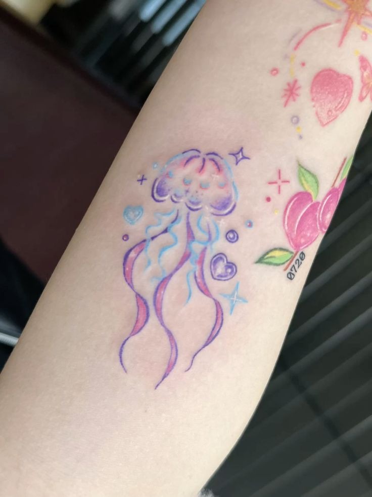 Cute kawaii pastel jellyfish tattoo with pink blushing cheeks and micro heart bubbles