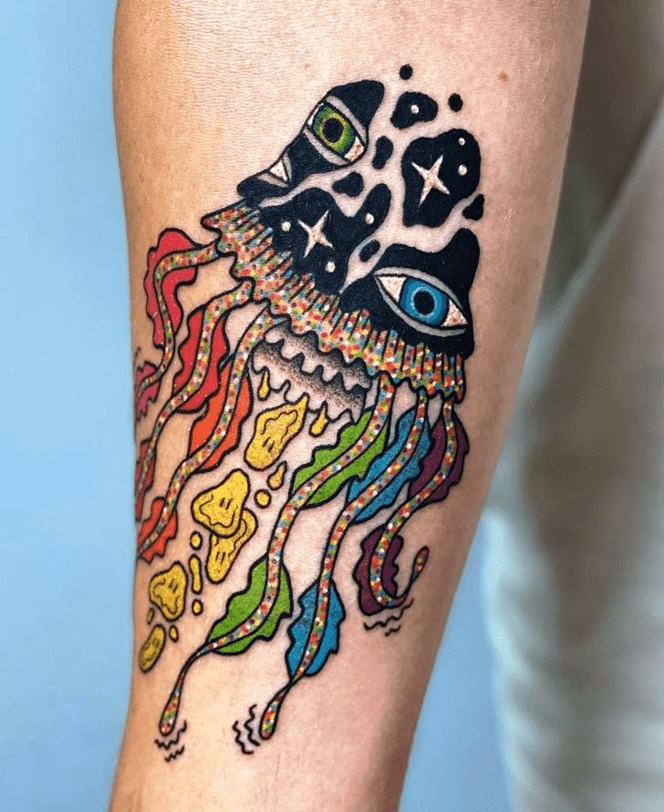 Surrealist jellyfish tattoo with stylized watchful eyes nestled inside the translucent bell