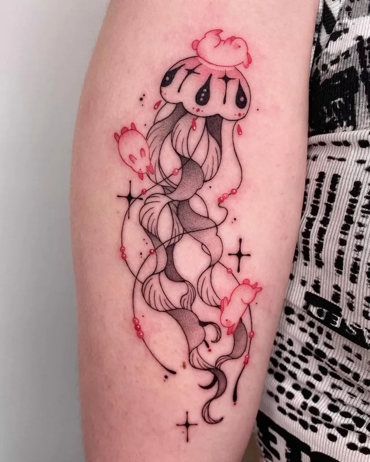 Gothic style jellyfish tattoo with Victorian filigree crown and dripping black ink tendrils