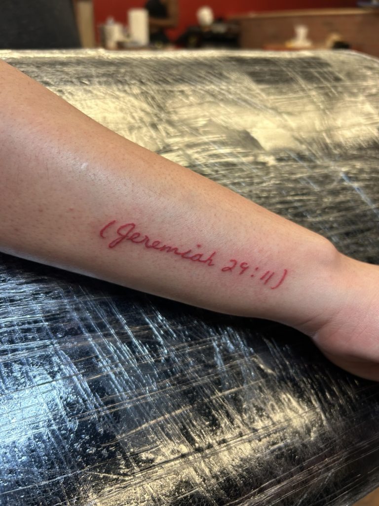 Bold and Modern Cursive Tattoo Design
