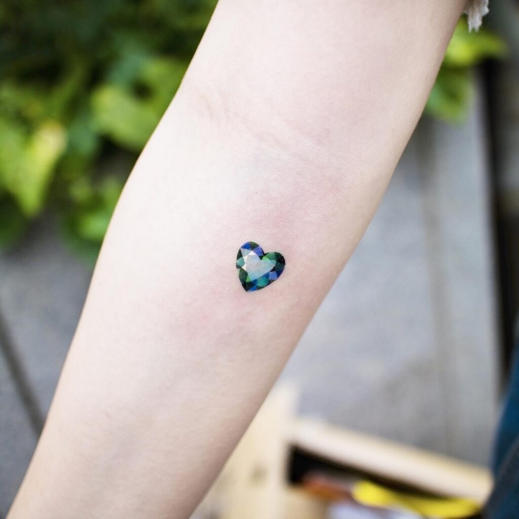 Iridescent Heart Gem Tattoo on Forearm Tattoo Design