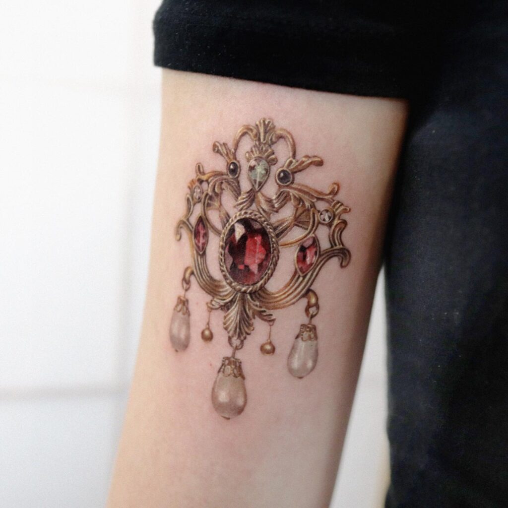Ornate Ruby and Pearl Brooch Tattoo Tattoo Design