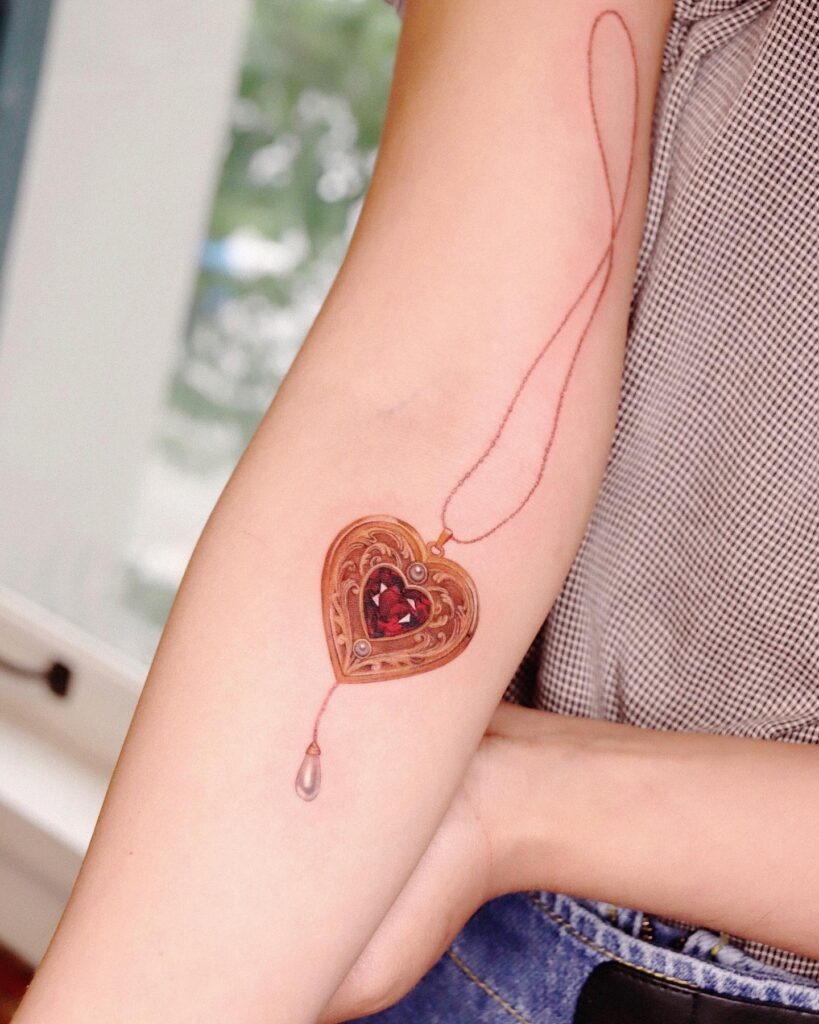 Vintage Heart Pendant Tattoo with Gemstone Detail Tattoo Design
