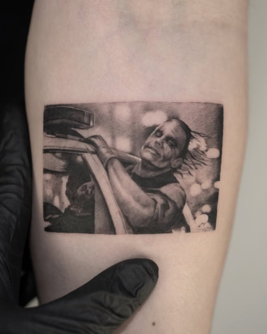 Dramatic Joker Scene Tattoo in Black and Gray Tattoo Design