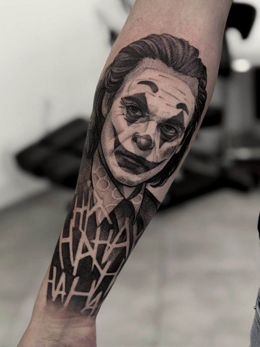 Intricate Joker Tattoo with Ha Ha Background Tattoo Design