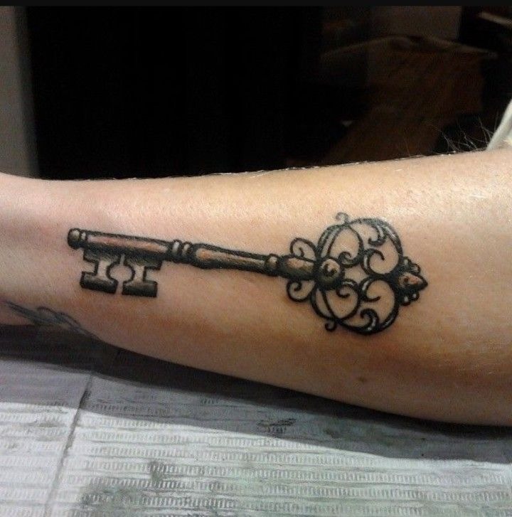 Bold Traditional Ornamental Key Tattoo Design