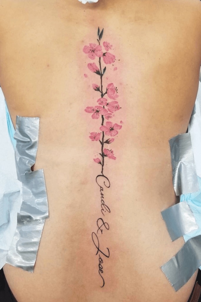 Beautiful Line Work Spine Piece with Child Name Tattoo Design