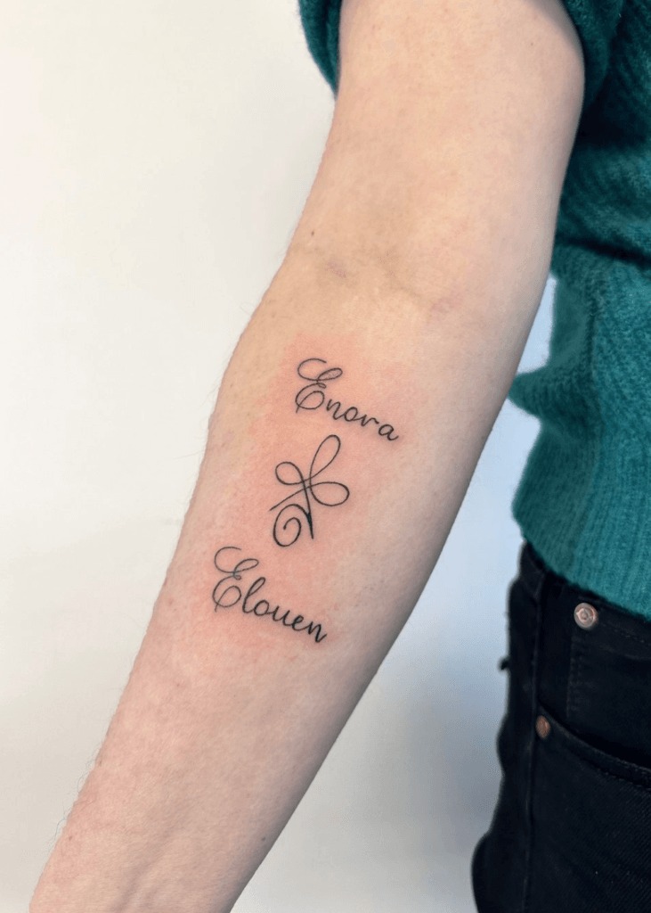 Cherry Blossom & Names Tattoo on Spine Tattoo Design