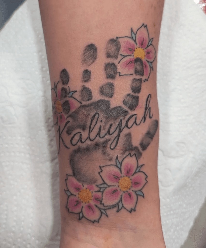 Mother Holding a Baby in a Tender Embrace Tattoo Design