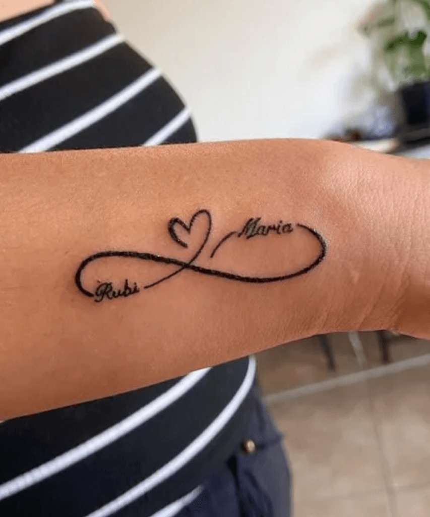 Tattoo With Child's face, Flowers, & Name Tattoo Design