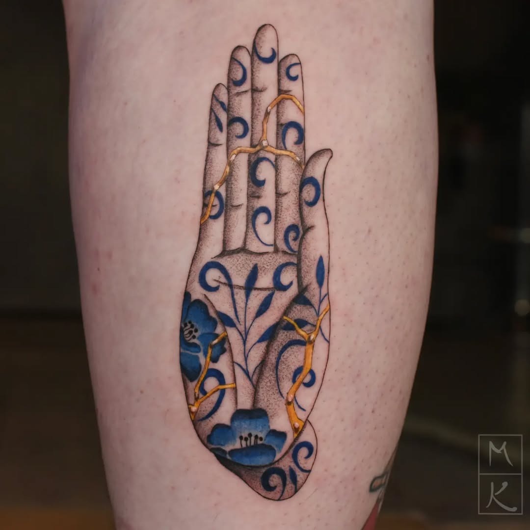 Artistic Kintsugi Hand Tattoo with Floral Elements Tattoo Design