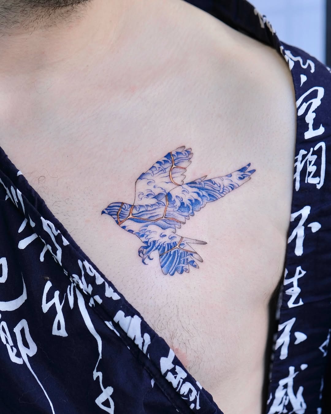 Elegant bird tattoo showcasing kintsugi artistry Tattoo Design