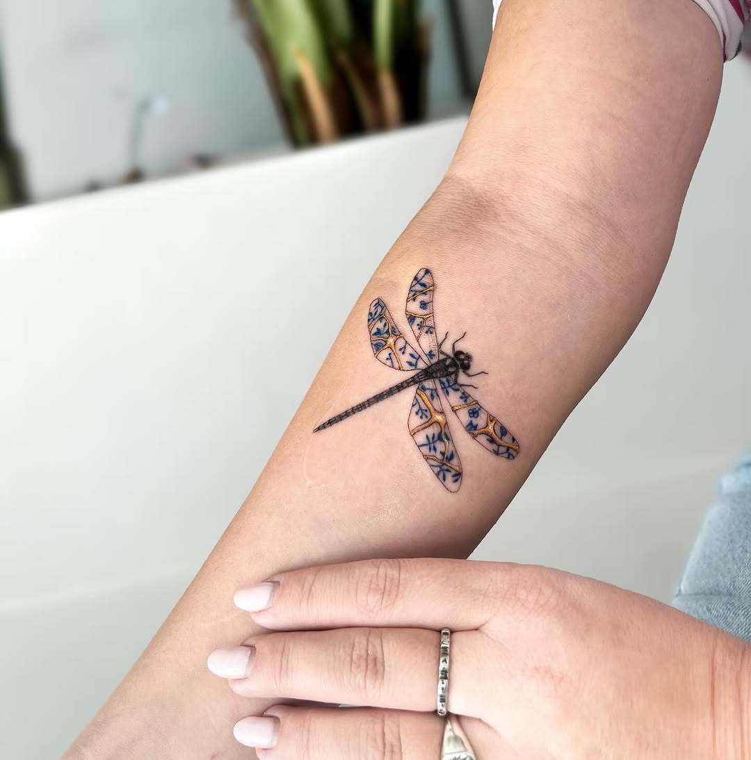 Elegant dragonfly tattoo with kintsugi artistry Tattoo Design