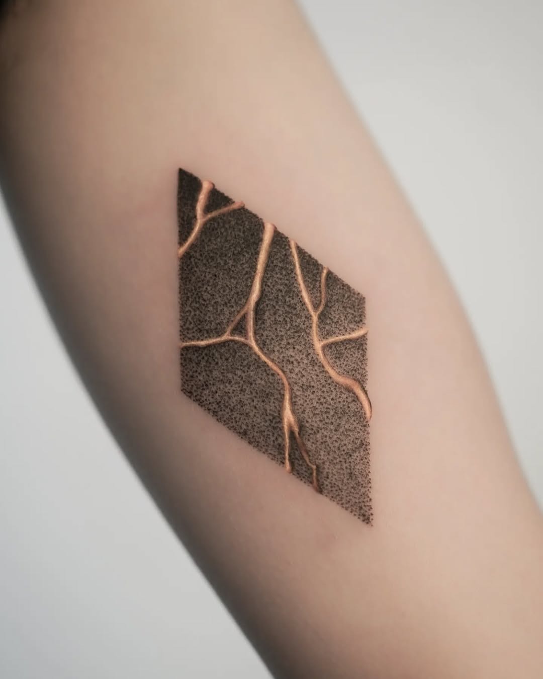 Geometric Kintsugi Tattoo with Golden Details Tattoo Design