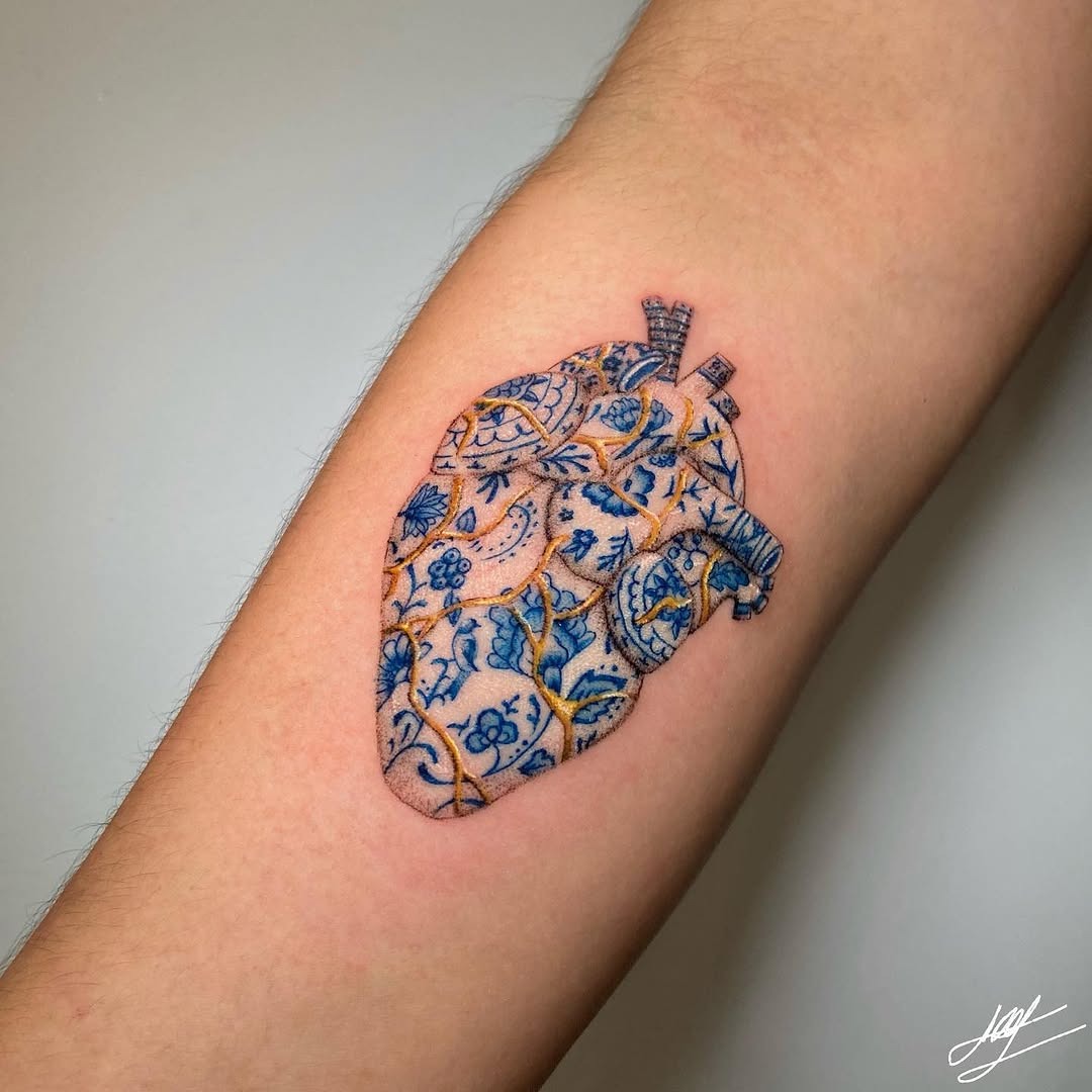 Intricate heart tattoo with kintsugi details Tattoo Design