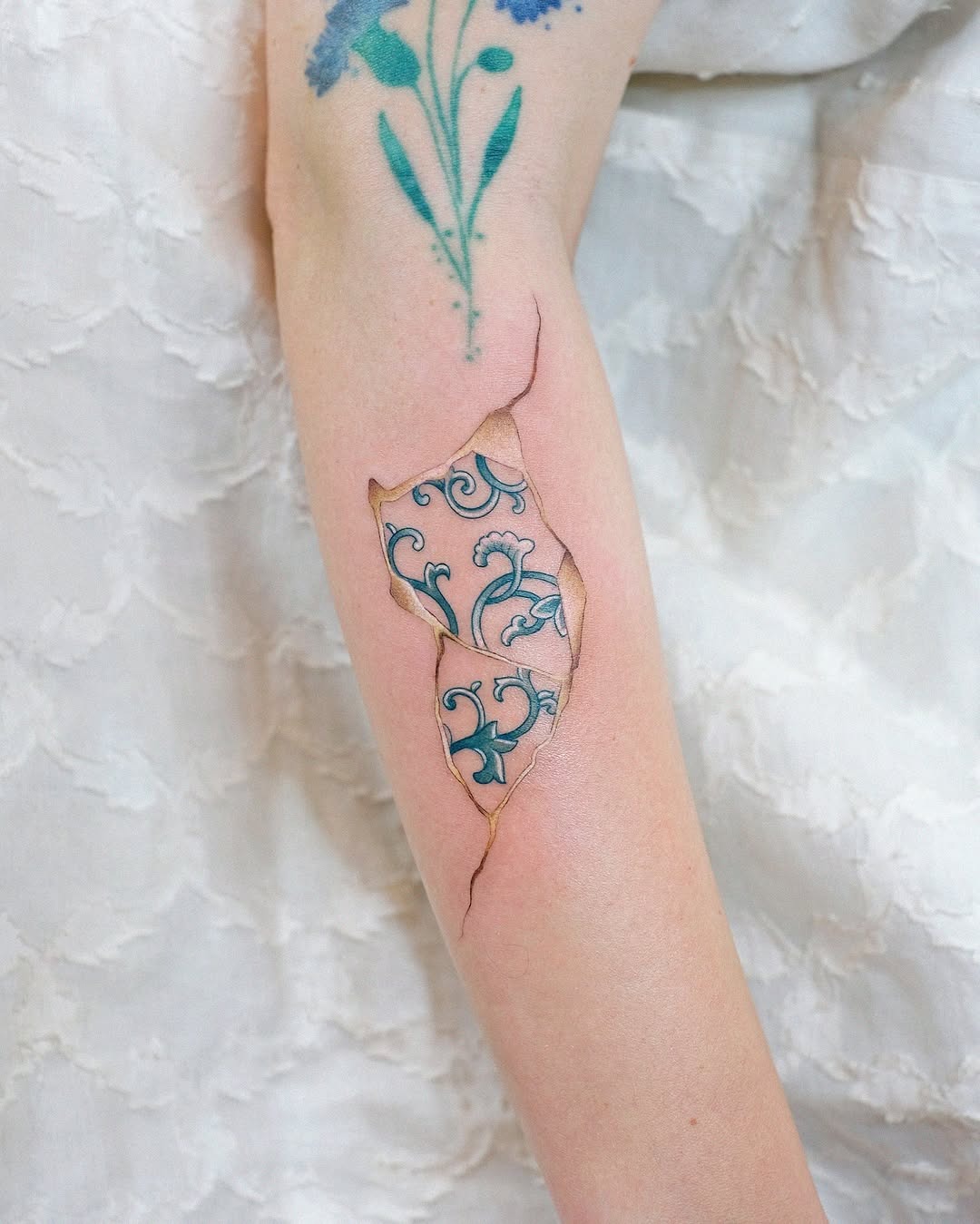 Unique kintsugi tattoo showcasing delicate floral patterns Tattoo Design