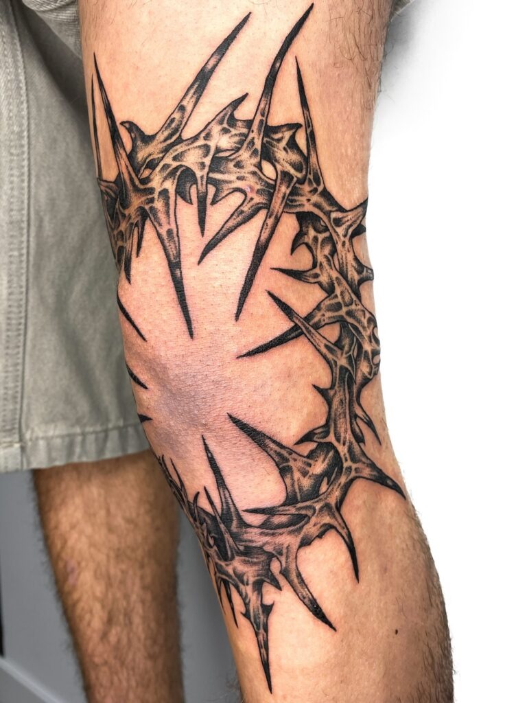 Aggressive Thorned Knee Frame Tattoo Tattoo Design