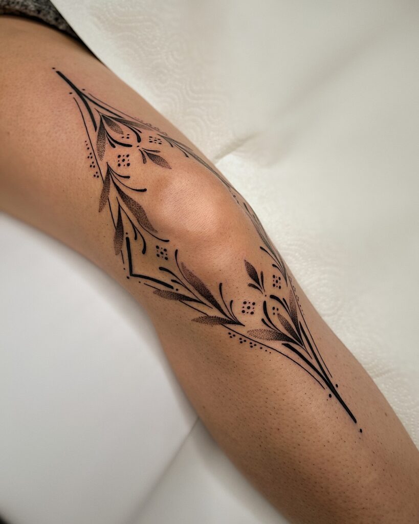 Ornamental Knee Frame with Flowing Lines Tattoo Design