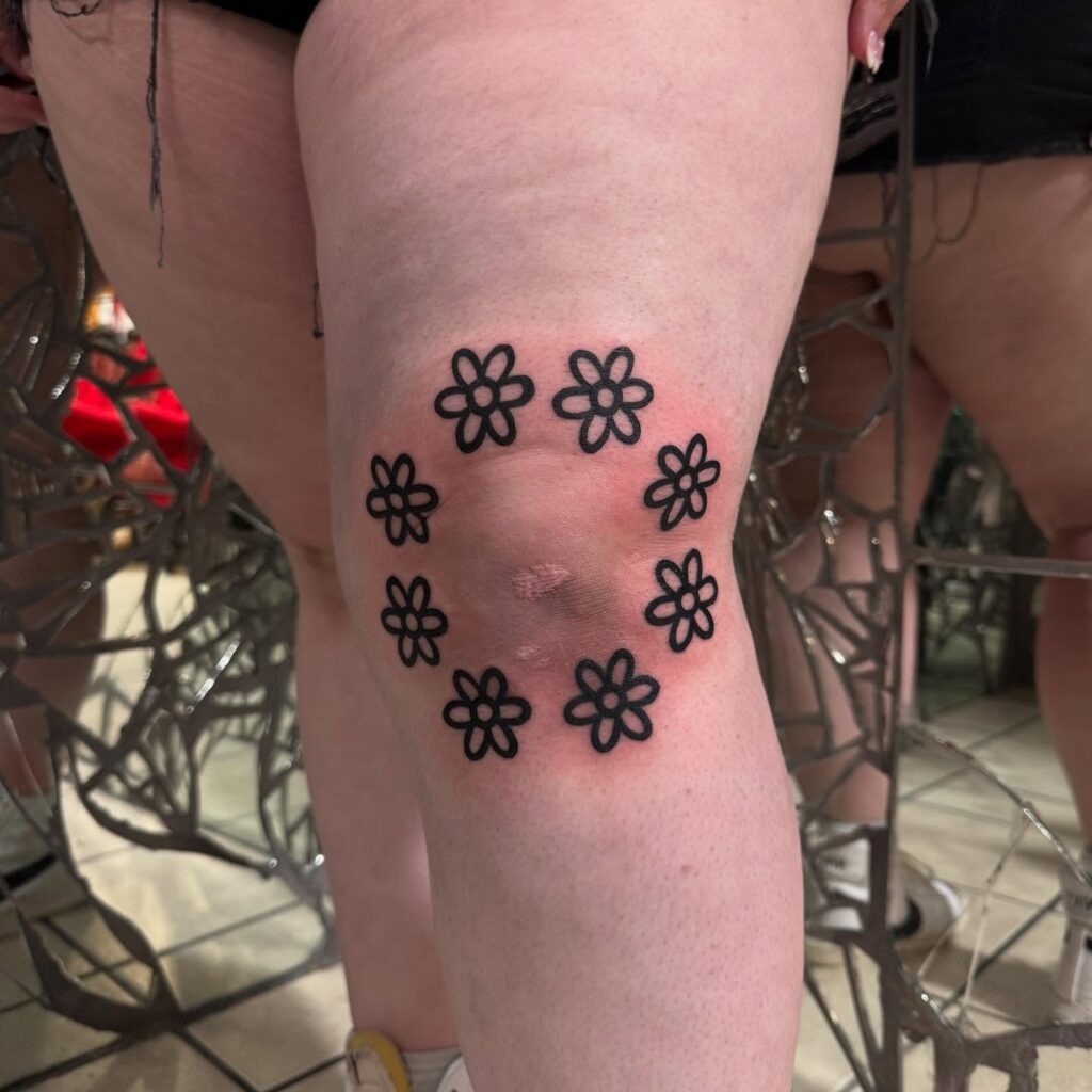 Playful Daisy Circle Knee Frame Tattoo Design