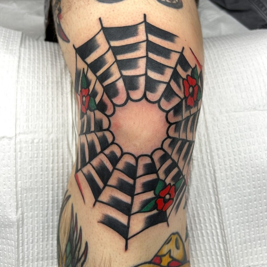 Spider Web Knee Frame with Bold Traditional Details Tattoo Design